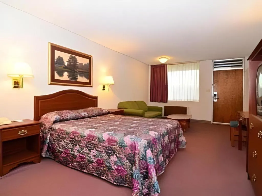 Bed in SureStay Hotel