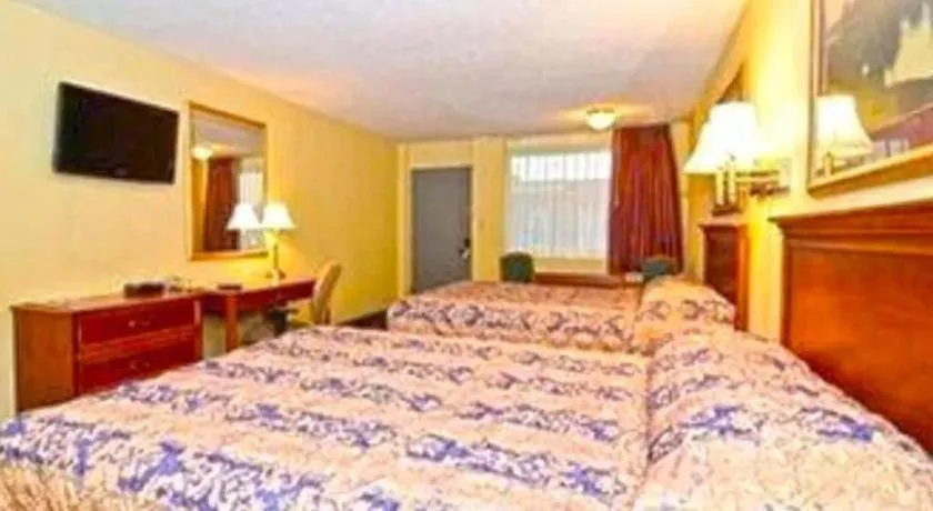 Bed in SureStay Hotel