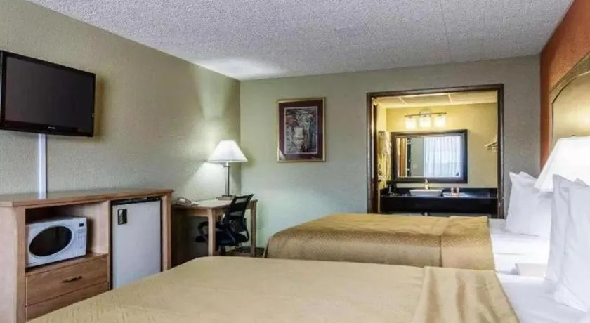 Bed in SureStay Hotel