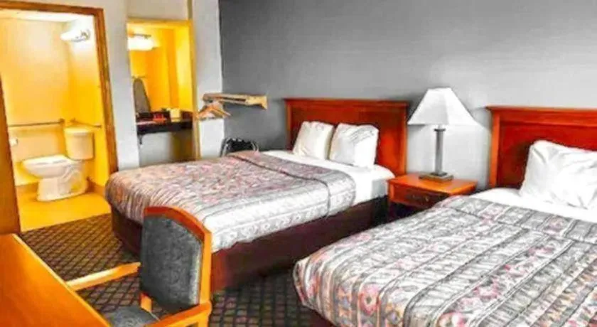 Bed in SureStay Hotel