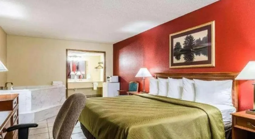 Bed in SureStay Hotel