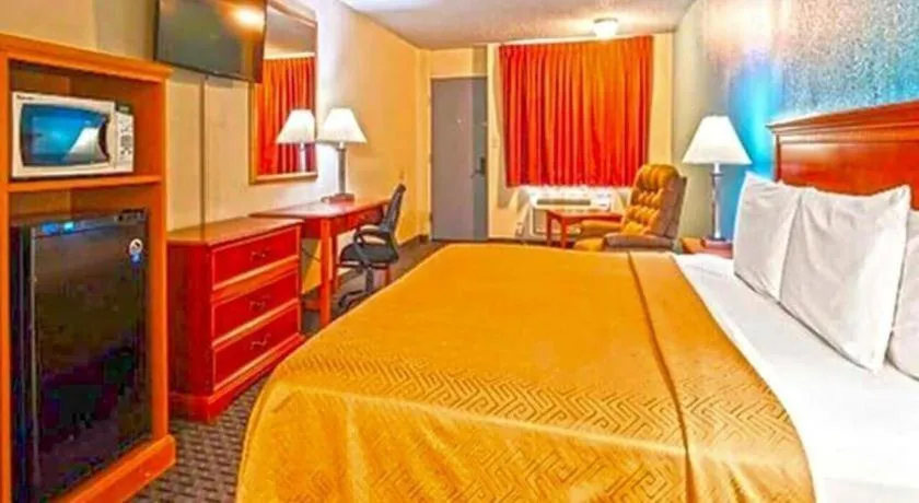 Bed in SureStay Hotel