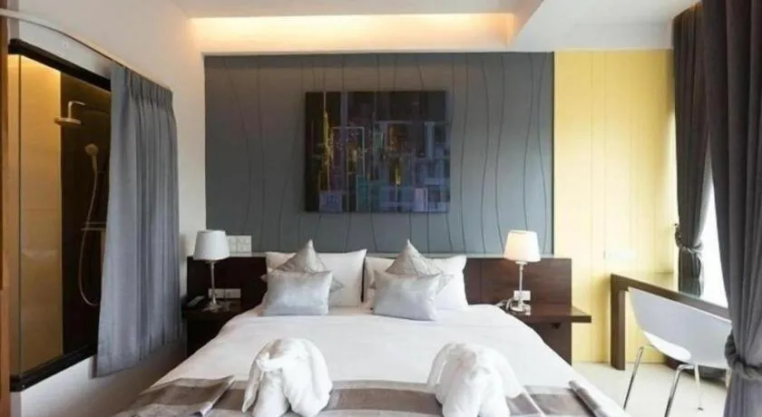 Bed in Vulcano Hotel at Nimman