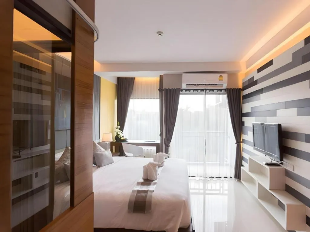 Bed in Vulcano Hotel at Nimman