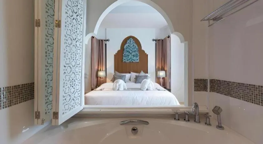 Bed in Vulcano Hotel at Nimman