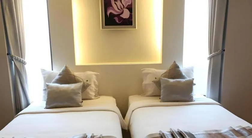 Bed in Vulcano Hotel at Nimman