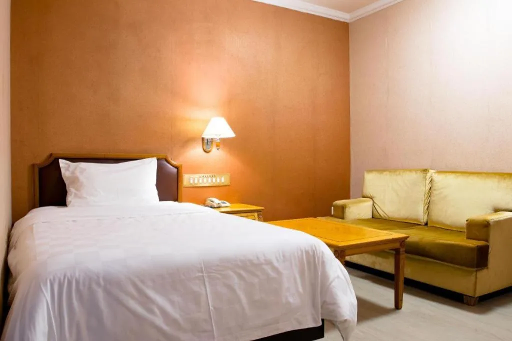 Bed in Nanfang Dasha Hotel