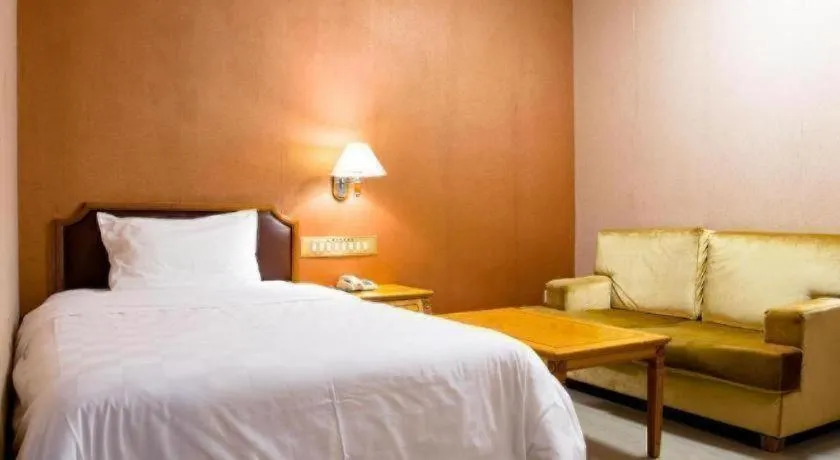 Bed in Nanfang Dasha Hotel