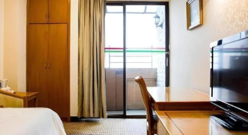 Bed in Nanfang Dasha Hotel