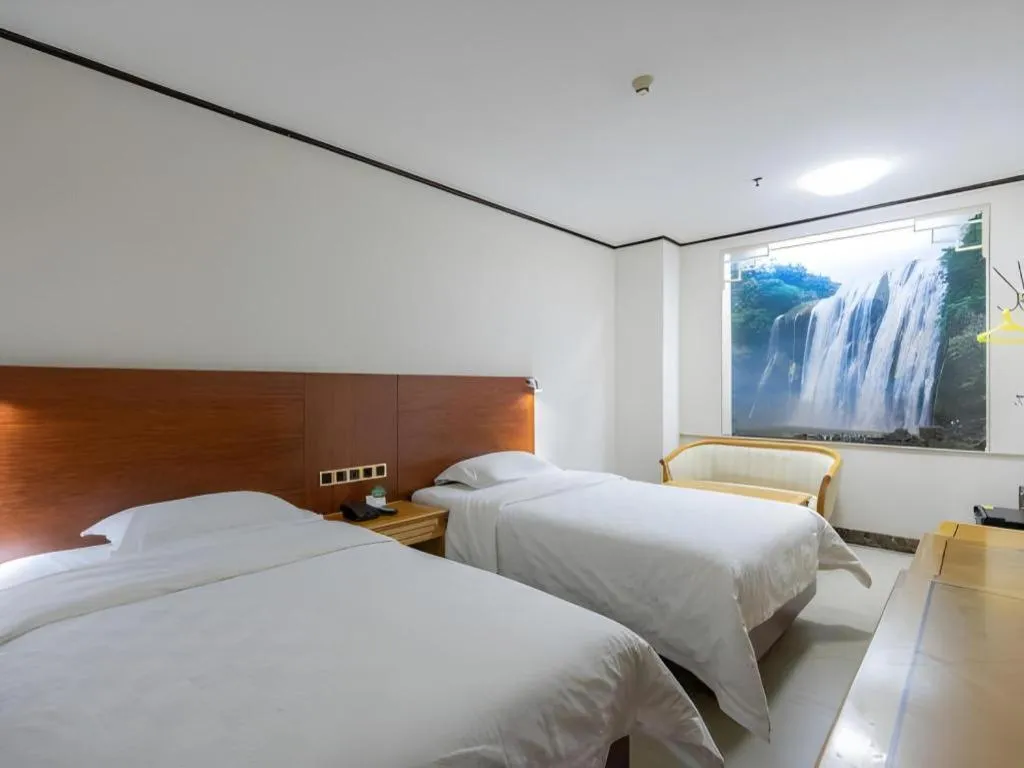 Bed in Nanfang Dasha Hotel