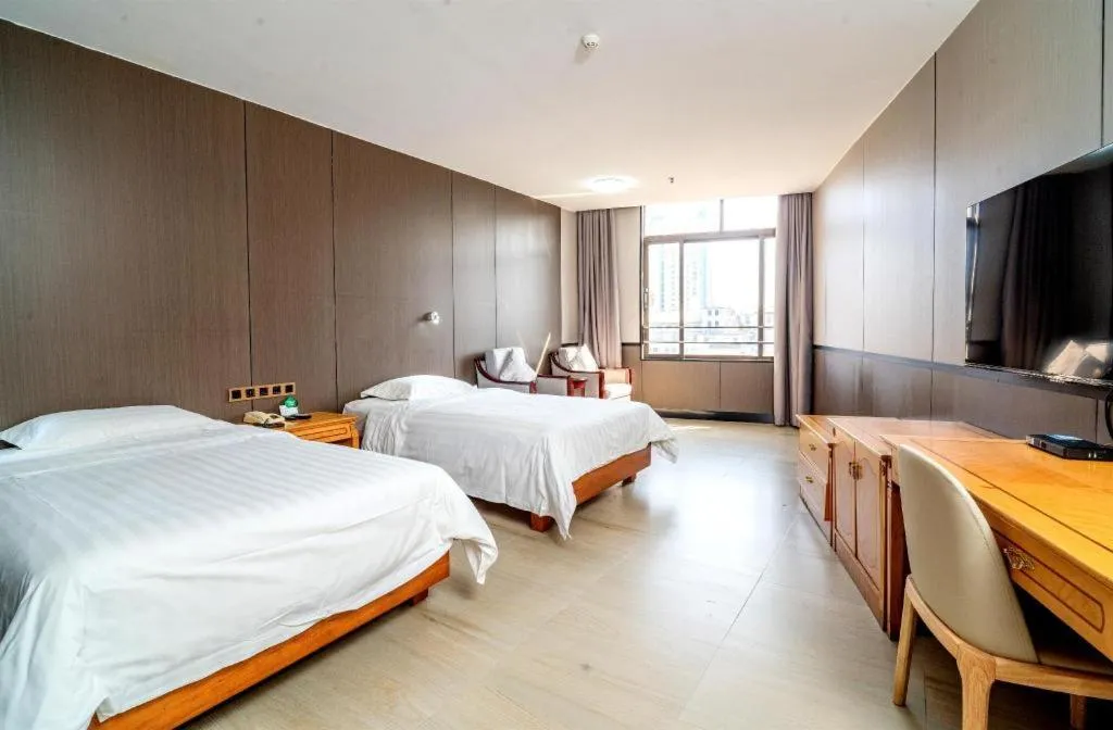 Bed in Nanfang Dasha Hotel