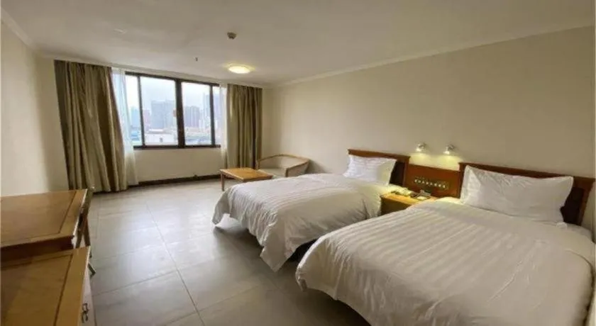 Bed in Nanfang Dasha Hotel