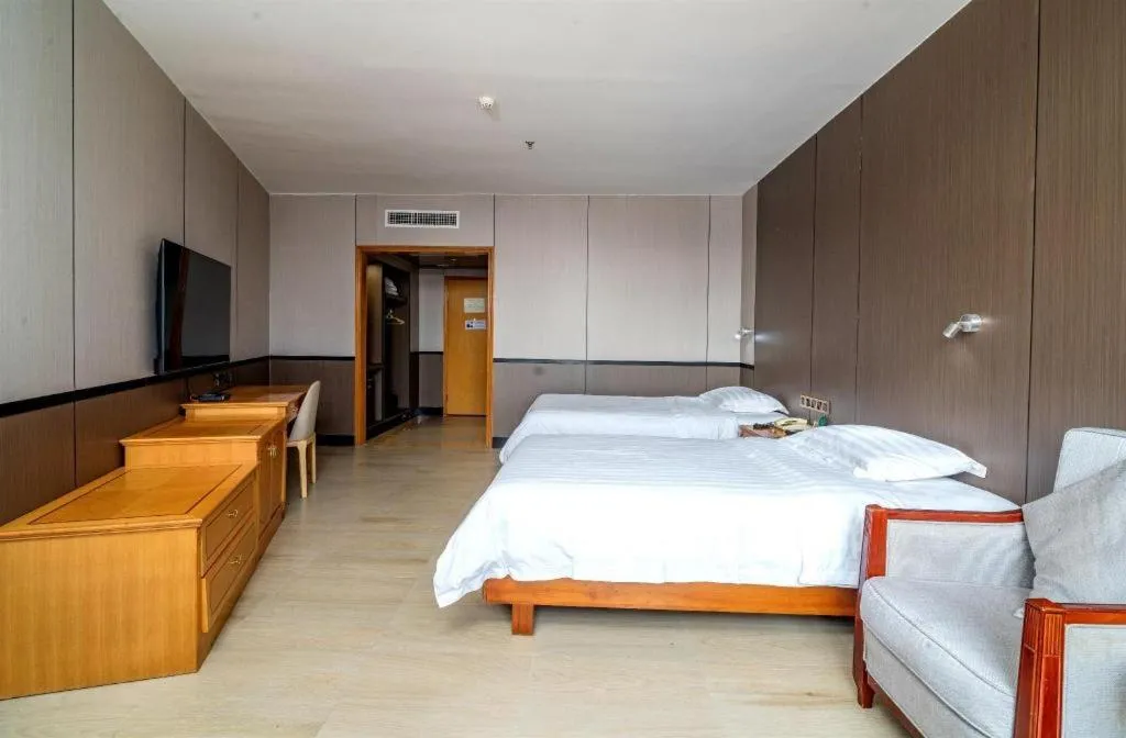 Bed in Nanfang Dasha Hotel