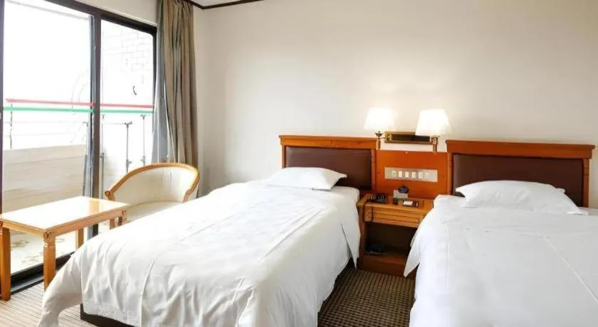 Bed in Nanfang Dasha Hotel