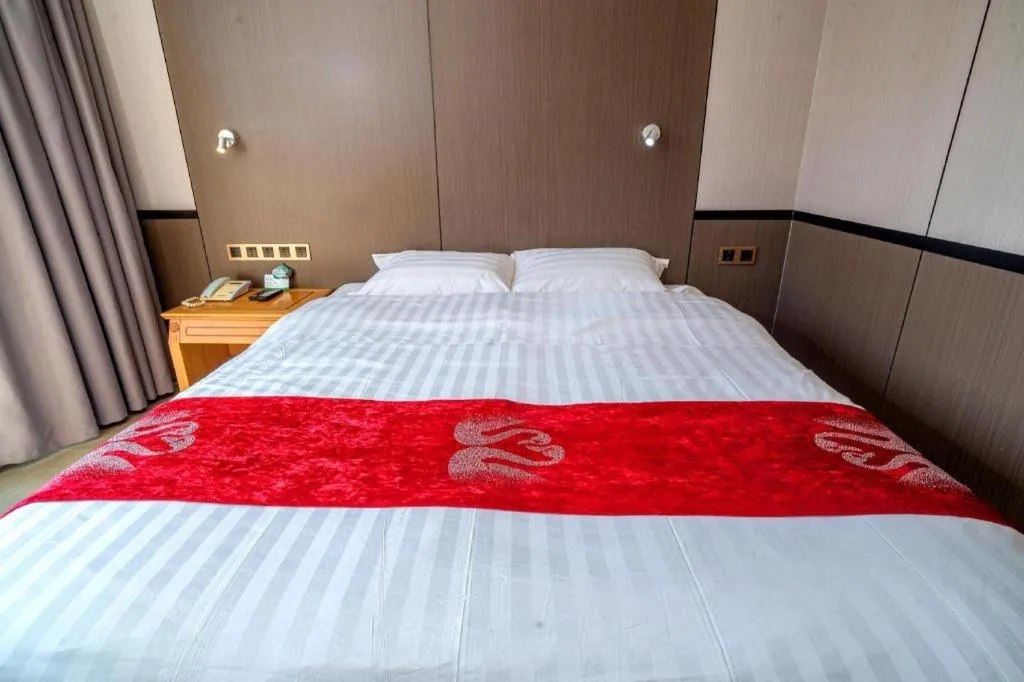 Bed in Nanfang Dasha Hotel
