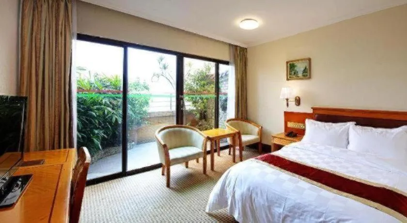 Bed in Nanfang Dasha Hotel