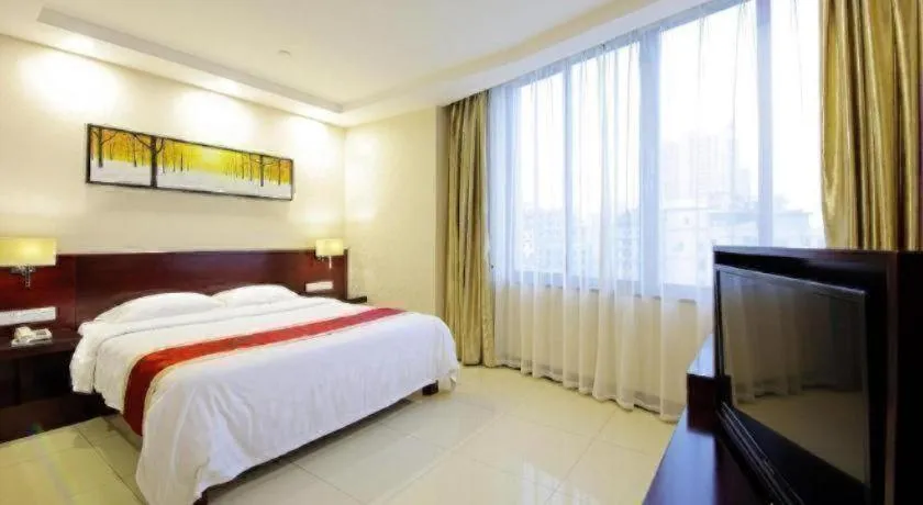 Bed in Nanfang Dasha Hotel