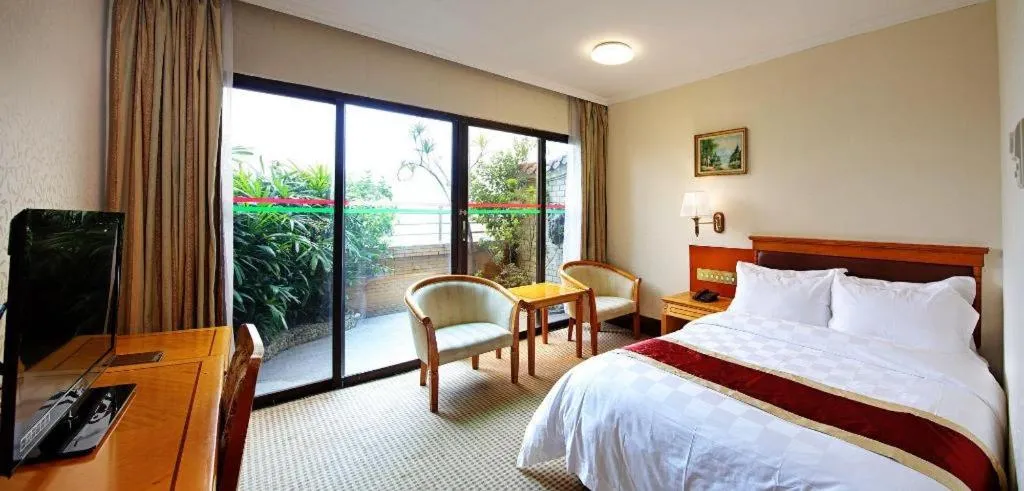 Bed in Nanfang Dasha Hotel