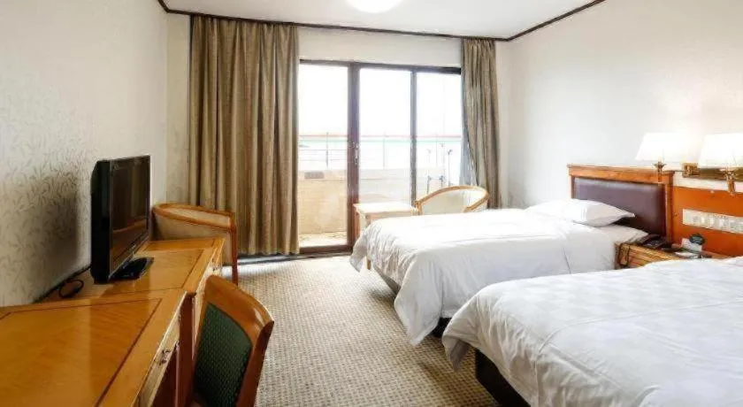 Bed in Nanfang Dasha Hotel