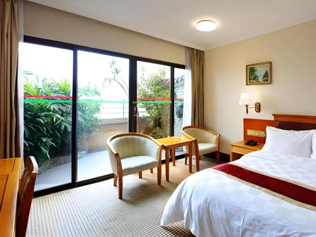 Bed in Nanfang Dasha Hotel