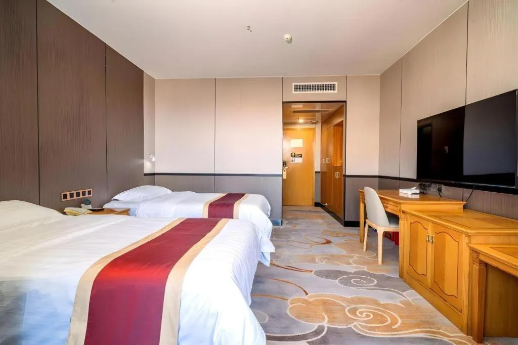 Bed in Nanfang Dasha Hotel