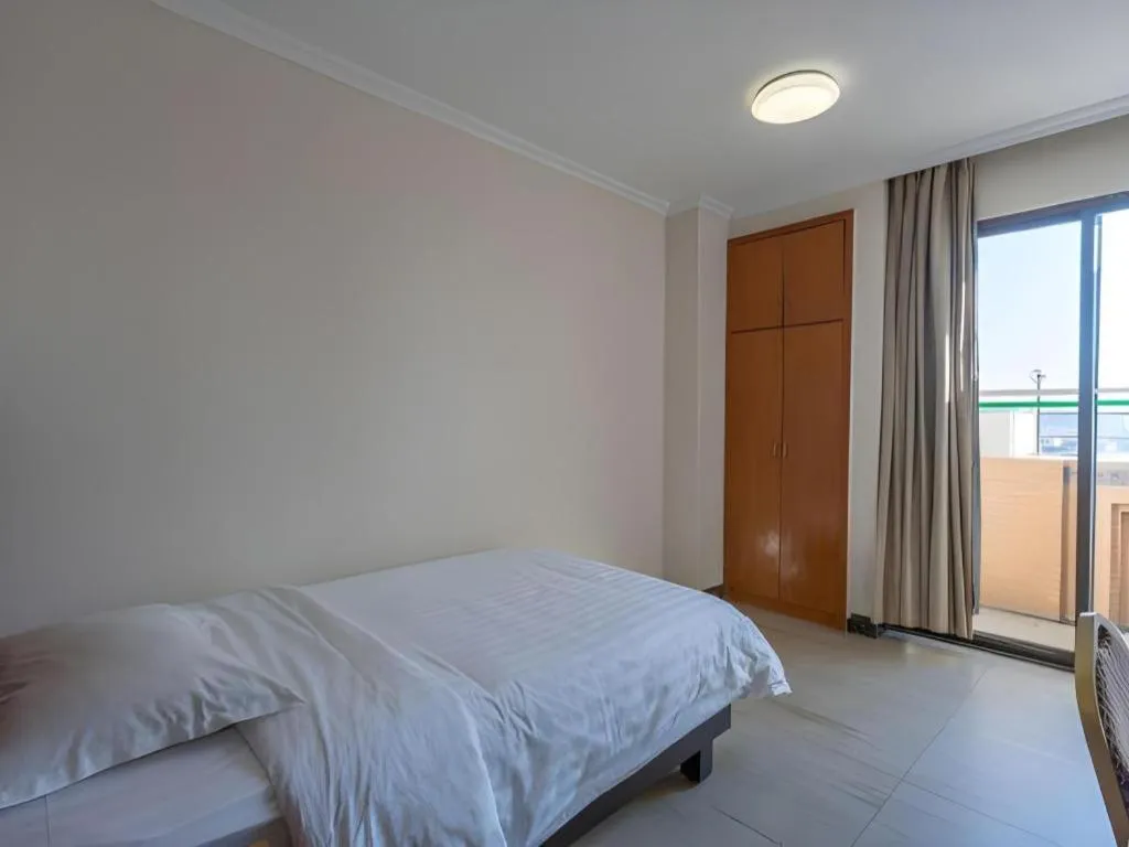 Bed in Nanfang Dasha Hotel