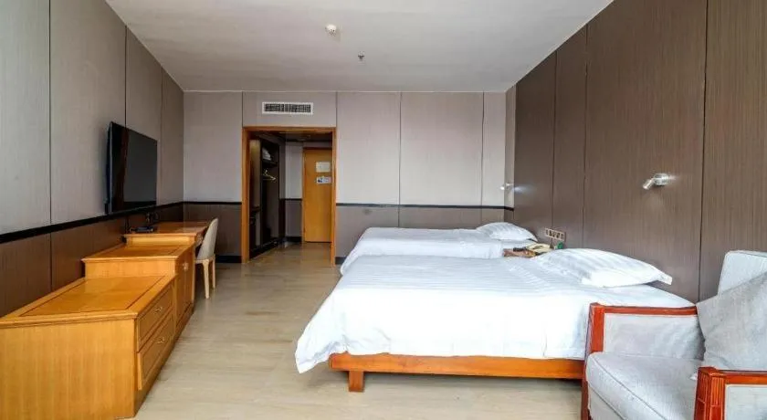 Bed in Nanfang Dasha Hotel