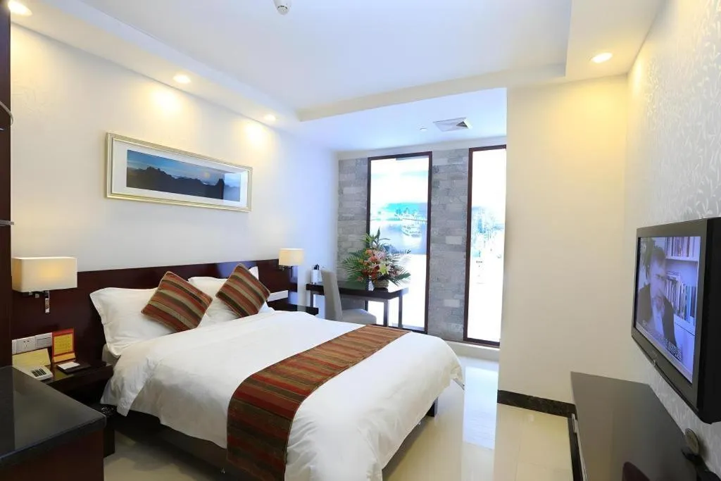 Bed in Nanfang Dasha Hotel