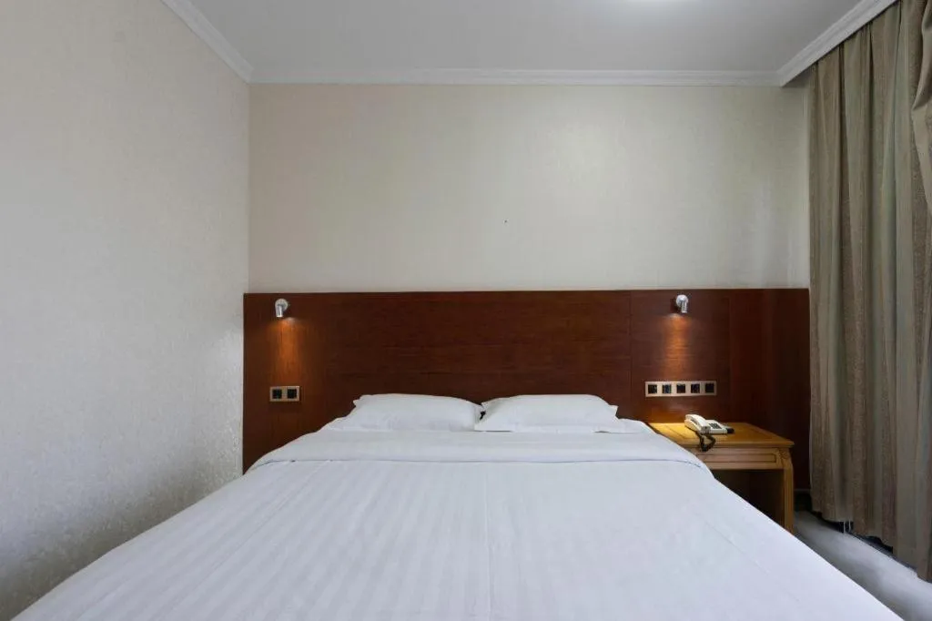 Bed in Nanfang Dasha Hotel