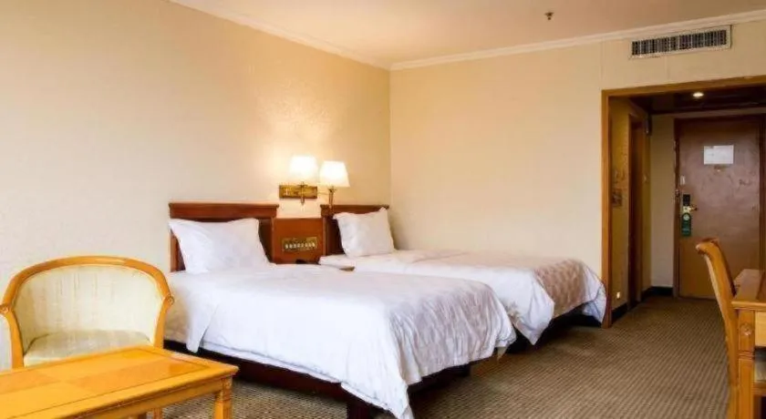 Bed in Nanfang Dasha Hotel