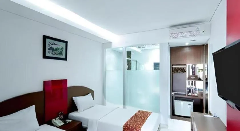 Bed in Kenari Asri Hotel