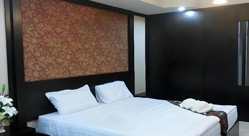 Bed in Le Parc Wangnang Hotel