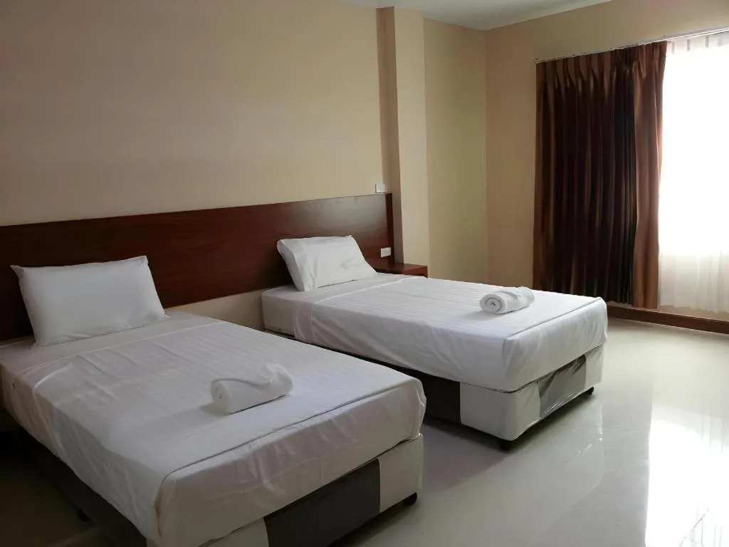 Bed in Le Parc Wangnang Hotel