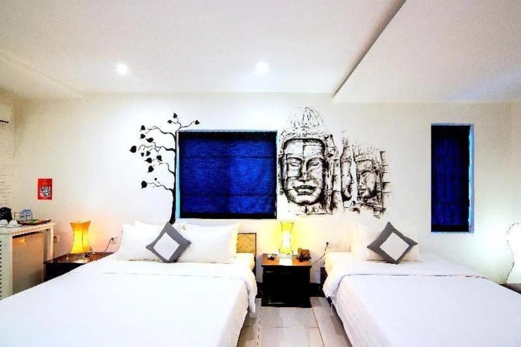 Bed in La Residence Blanc D' Angkor