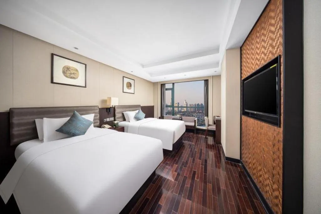 Bed in Yiwu Orange Boutique Hotel