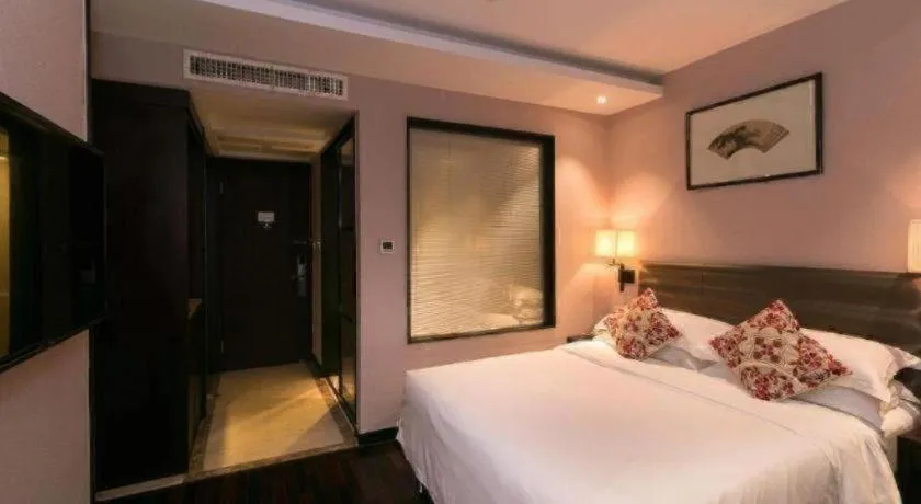 Bed in Yiwu Orange Boutique Hotel