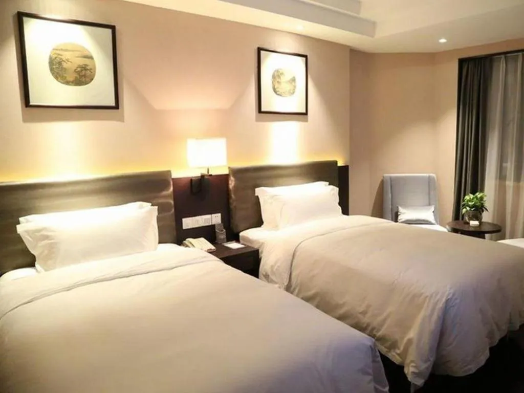 Bed in Yiwu Orange Boutique Hotel