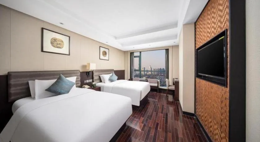 Bed in Yiwu Orange Boutique Hotel