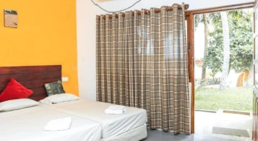 Bed in New Tristar Beach Hotel