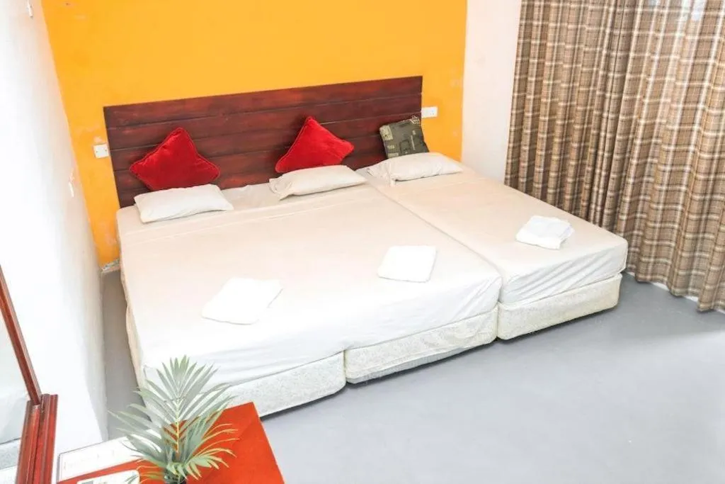 Bed in New Tristar Beach Hotel