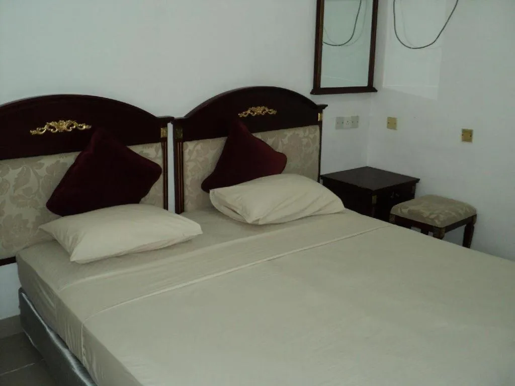 Bed in New Tristar Beach Hotel