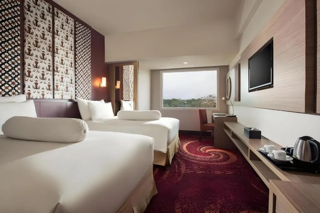 Bed in Indoluxe Hotel Jogjakarta