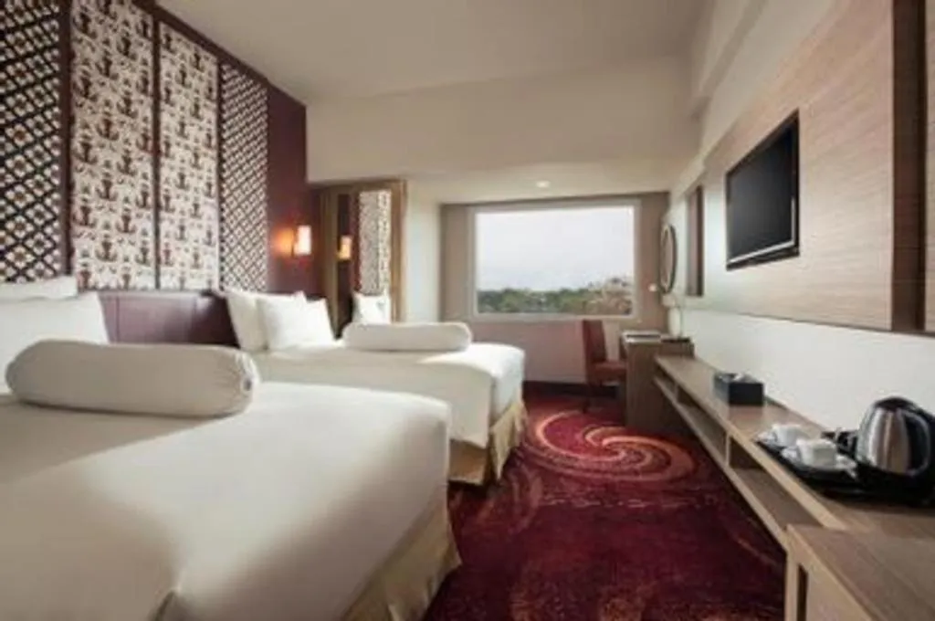 Bed in Indoluxe Hotel Jogjakarta