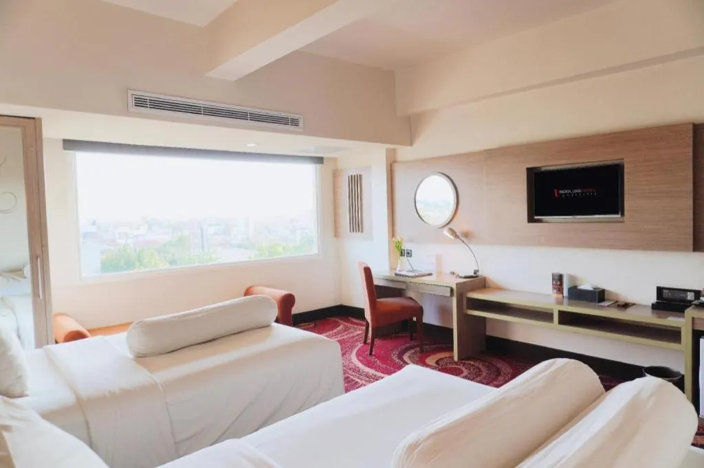 Bed in Indoluxe Hotel Jogjakarta