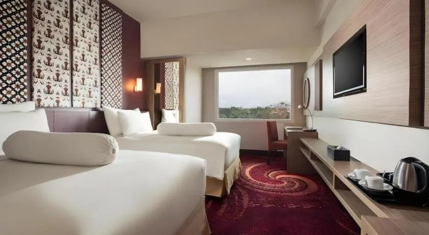 Bed in Indoluxe Hotel Jogjakarta