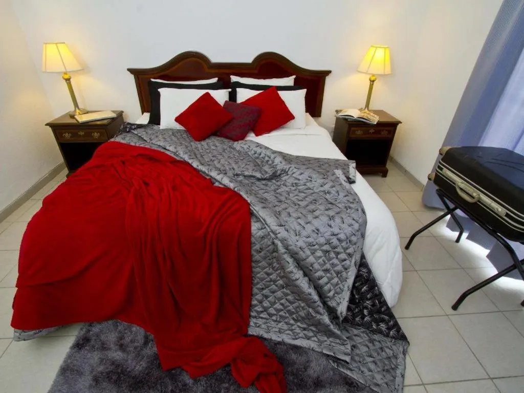 Bed in Terranova Suites