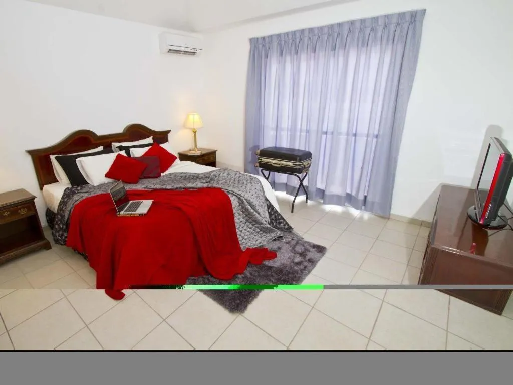 Bed in Terranova Suites