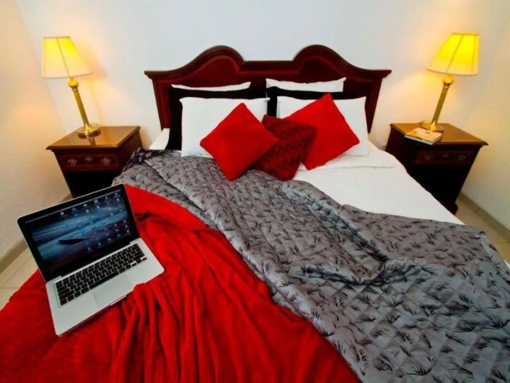 Bed in Terranova Suites