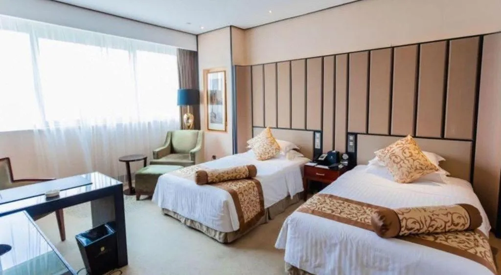 Bed in Jiuhua Jin Jiang International Hotel