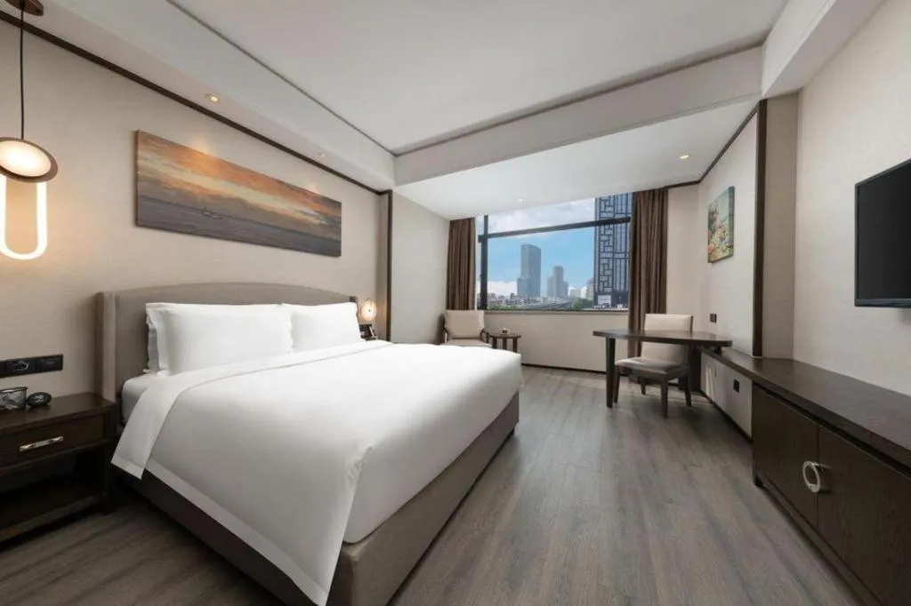 Bed in Zhuhai Starlight Hotel